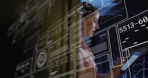 Mid-adult woman holding tablet interacting with holographic ui panels and data analytics