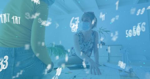 Colleagues Collaborate with Floating Numbers in Modern Office