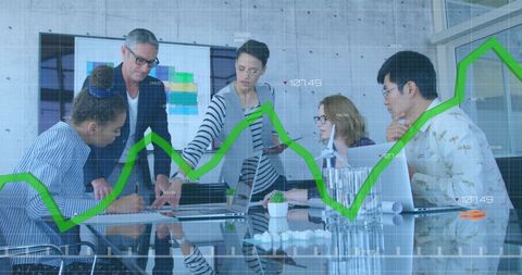 Diverse Team Analyzing Financial Data with Digital Graph