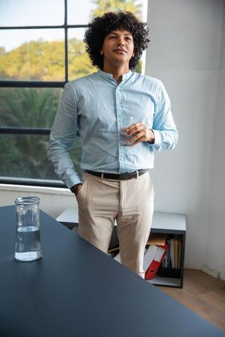 Young professional refreshing in modern office environment