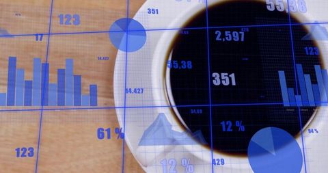 Overhead coffee cup with blue analytics overlays on wooden desk showing charts and graphs