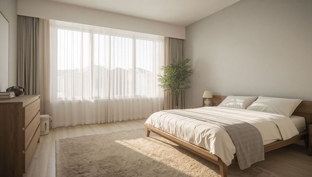 Sunlit scandinavian bedroom featuring low wooden platform bed, neutral linen, minimalist design