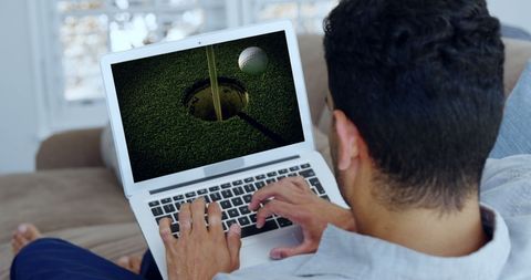 Young Male Enjoying Golf Online at Home - Download Free Stock Images Pikwizard.com