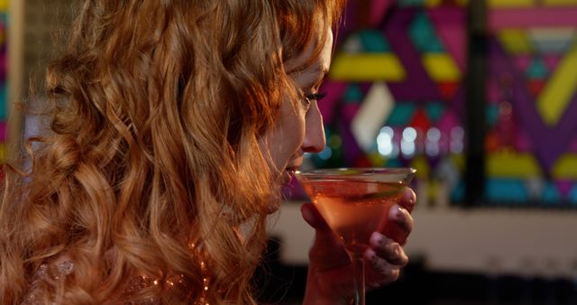 Beautiful woman drinking cocktail in bar - Download Free Stock Photos Pikwizard.com