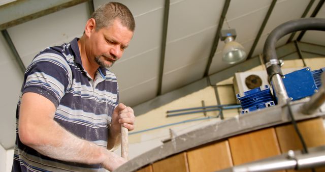 Adult Male Brewer Stirring Ingredients in Brewery - Download Free Stock Images Pikwizard.com