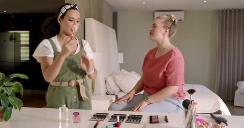 Diverse Female Friends Exploring Makeup Techniques Together