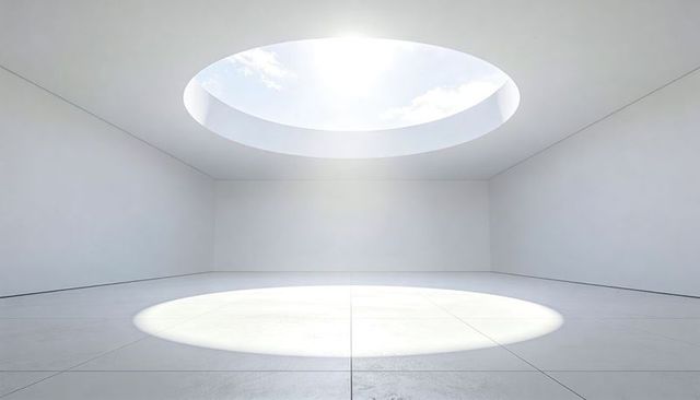 Minimal white gallery with circular skylight casting dramatic round daylight pool of light