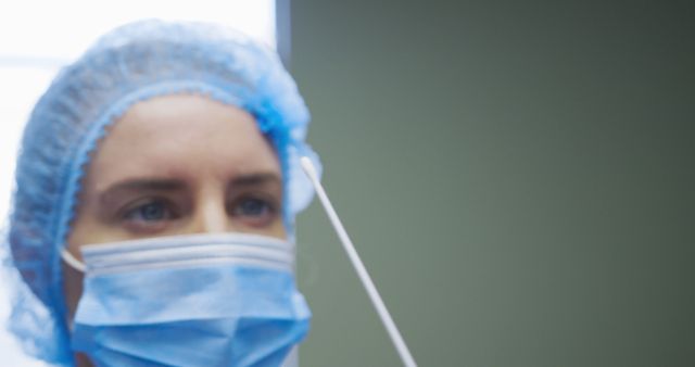 Healthcare Worker in Protective Gear Conducting a Medical Test - Download Free Stock Images Pikwizard.com