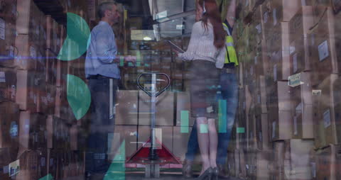 Warehouse Workers Analyzing Data Over Graphs