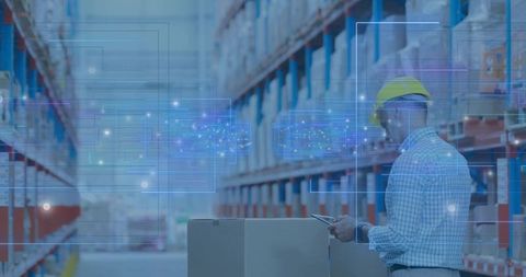 Warehouse Worker Using Tablet with Augmented Reality Inventory Overlay