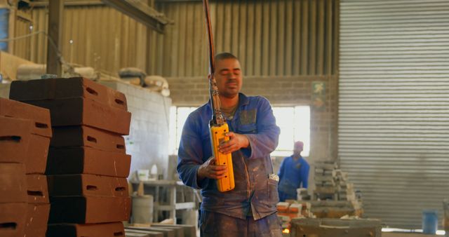 Factory Worker Operating Industrial Crane in Manufacturing Plant - Download Free Stock Images Pikwizard.com