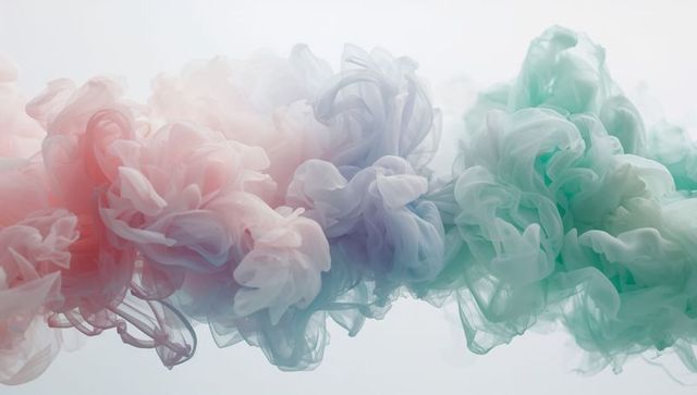 Pastel Ink Plumes Drifting in Water Creating Ethereal Cloudlike Folds