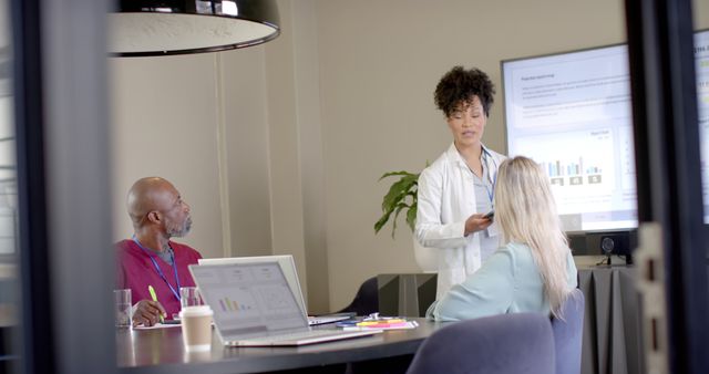 Healthcare Professionals Discussing Charts at Boardroom Meeting - Download Free Stock Images Pikwizard.com