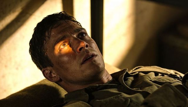 Wounded soldier lying on cot in canvas tent, sunlight crossing eye, gritty battlefield tension