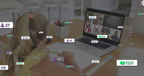 Young girl writing during virtual classroom with laptop badges and engagement icons