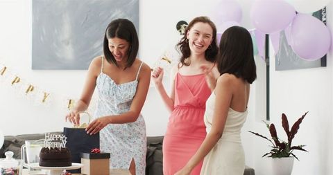 Joyful Birthday Preparation by Diverse Female Friends
