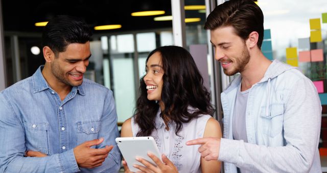 Team of Young Professionals Collaborating with Digital Tablet in Office - Download Free Stock Images Pikwizard.com