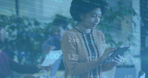 Diverse Professionals Analyzing Financial Reports on Tablet