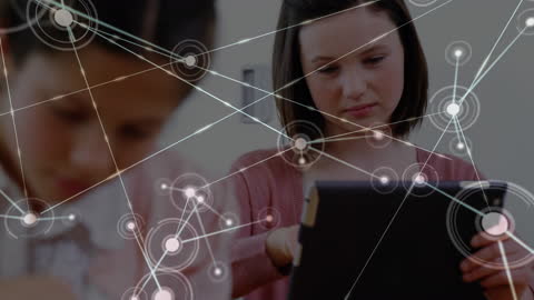 Focused Young Student Learning with Digital Tablet in Tech-Enhanced Classroom