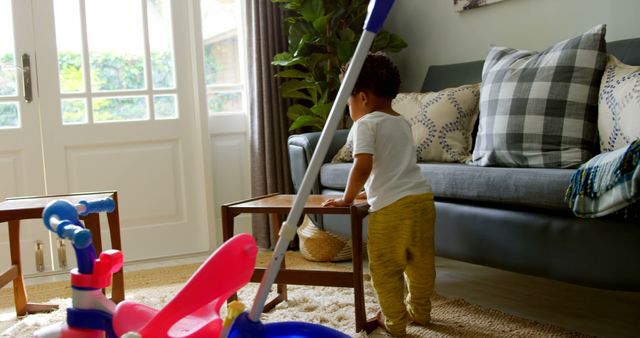 Toddler in Living Room Playing with Toys Near Sofa and Window - Download Free Stock Images Pikwizard.com