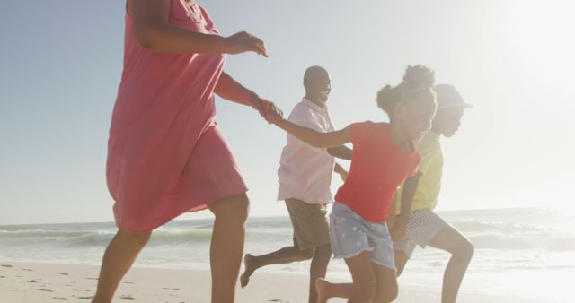 Joyful Family Running on Sunny Beach, Enjoying Vacation - Download Free Stock Images Pikwizard.com