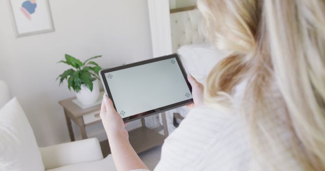 Woman Holding Digital Tablet in Bright Modern Living Room - Download Free Stock Images Pikwizard.com