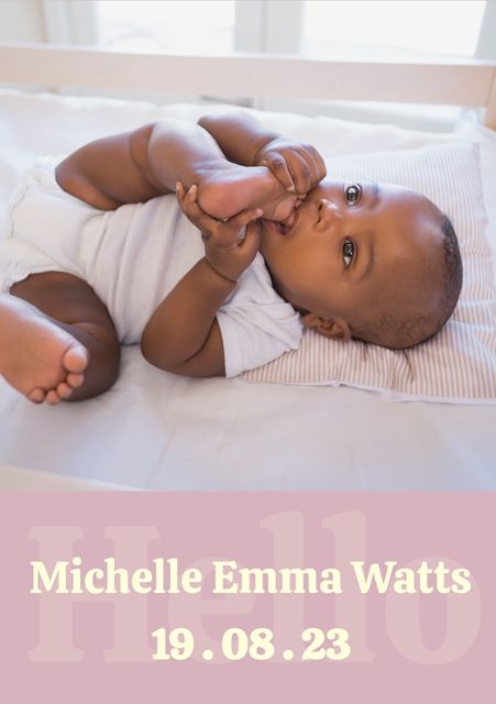 Shows an adorable African American baby lying on bed, with baby chewing own foot. Features customizable birth announcement text overlay including name 'Michelle Emma Watts' and birth date '19.08.23'. Ideal for birth announcements, baby cards, parenting blogs, child development articles, and social media posts highlighting new arrivals.
