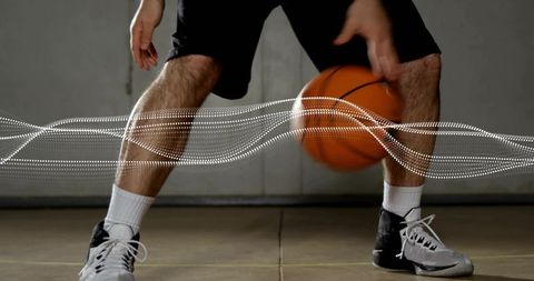 Basketball Player Dribbling Dynamically in Gym