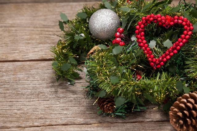 Perfect for holiday-themed projects, greeting cards, or seasonal advertisements. The rustic wooden background adds a warm, cozy feel, making it ideal for promoting Christmas events, home decor ideas, or festive crafts.