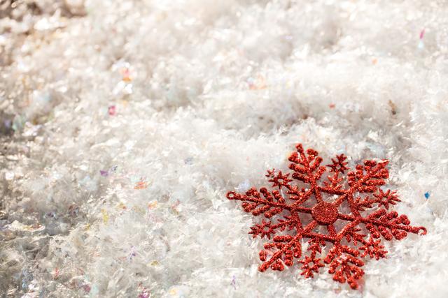 snowflake decoration on fake snow during christmas time