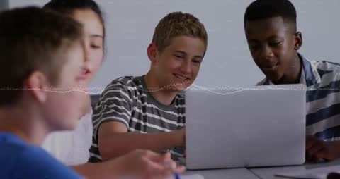 Students Collaborating on School Project Using Laptop and Notebook