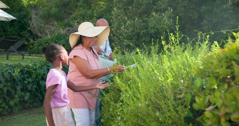 Senior Family Gardening Together in a Lush Backyard Setting