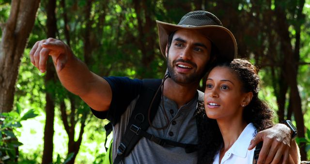 Couple Hiking in Forest Pointing at View - Download Free Stock Images Pikwizard.com