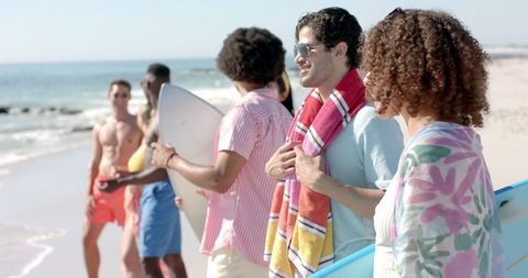 Diverse Group Enjoying Sunny Beach Day with Surfboards - Download Free Stock Images Pikwizard.com