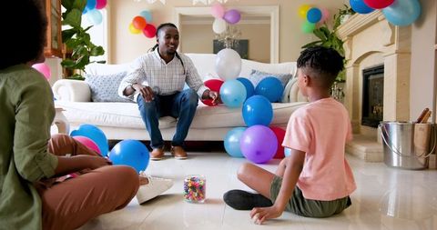 Joyful Family Celebrating Child's Birthday at Home