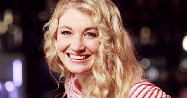 Smiling Young Woman with Blonde Curly Hair in Striped Shirt - Download Free Stock Images Pikwizard.com