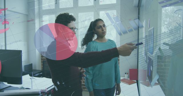 Team Analyzing Data Projections on Glass Wall in Modern Office - Download Free Stock Images Pikwizard.com