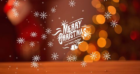 Merry Christmas Text with Snowflakes and Festive Bokeh Background