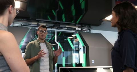 Diverse professionals discussing collaboration in modern office