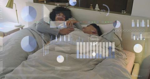 Couple sharing bed using smartphone with sleep and health data hud overlays