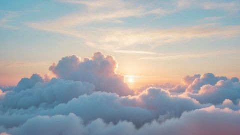 Serene sunrise amidst pastel cumulus clouds in sky