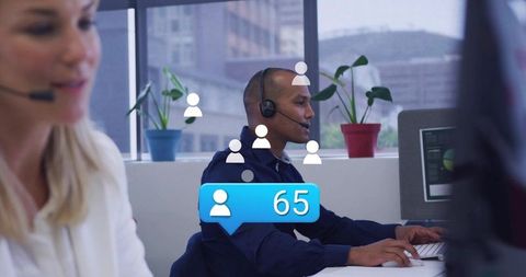 Call center agent typing with headset, open office, social notification overlay showing 65
