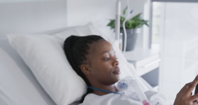 Young Woman Using Phone in Hospital Bed - Download Free Stock Images Pikwizard.com