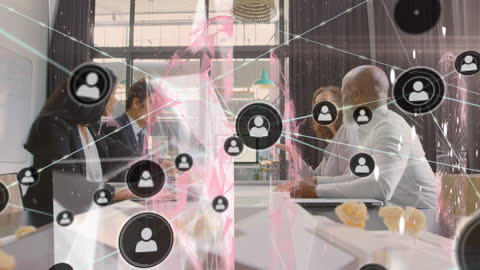 Digital Network Overlaid on Diverse Business Meeting In Office