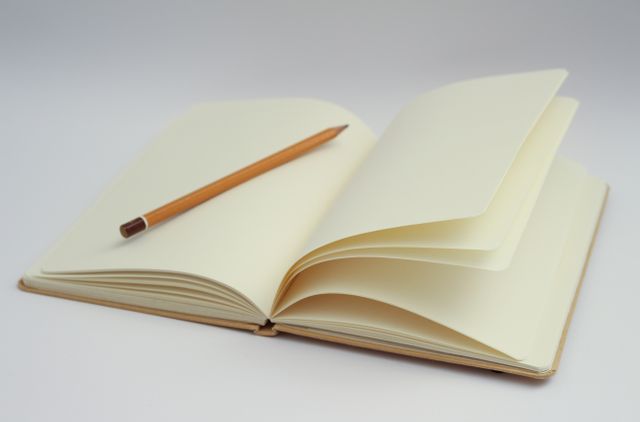 This image of an open notebook with blank pages and a pencil is ideal for themes related to writing, journaling, school, office work, or creativity. It can be used in advertisements for stationery products, blogs, websites on self-improvement, or educational materials showcasing supplies needed for students or classrooms.