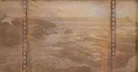 Retro film strip over rocky sunset shoreline digital composite