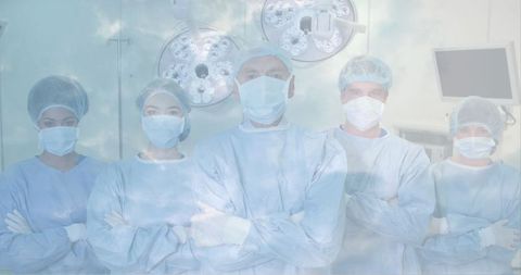Confident medical team in operating room embracing teamwork