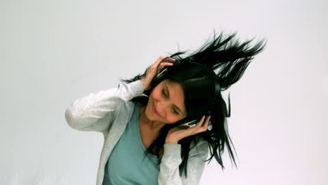 Woman Enjoying Music with Headphones in Slow Motion