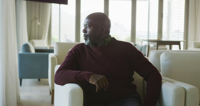 Pensive Senior Man Sitting in Modern Living Room - Download Free Stock Images Pikwizard.com