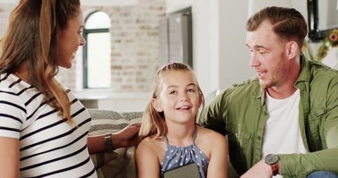 Happy Family Chatting Together in Living Room